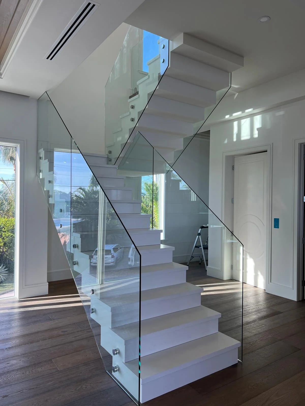 Custom glass staircase railing installation Miami