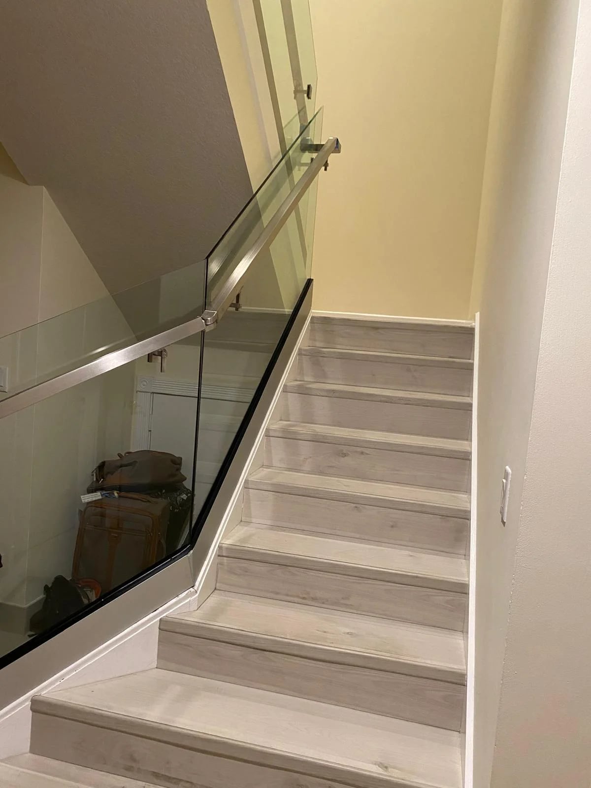Curved glass staircase railing installation Miami
